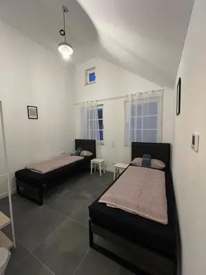 Ein Bett oder Betten in einem Zimmer der Unterkunft Ludwig Camas - Apartments