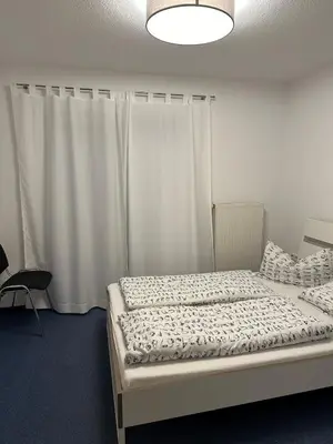 Ein Bett oder Betten in einem Zimmer der Unterkunft Sonnenlage - Ferienwohnung nahe Pforzheim-Karlsruhe - 7 Minuten zur A8