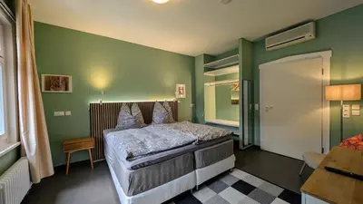 Ein Bett oder Betten in einem Zimmer der Unterkunft WOLKE - ankommen und Zuhause fühlen - Apart-VL