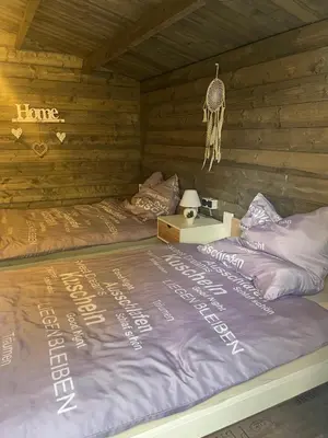 Ein Bett oder Betten in einem Zimmer der Unterkunft Forsthäuschen am Ponyhof
