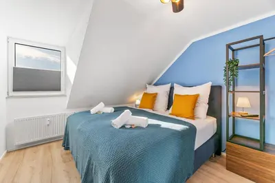 Ein Bett oder Betten in einem Zimmer der Unterkunft Zentral - 4 Schlafzimmer - Küche - Waschmaschine