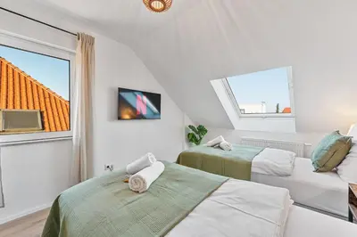 Ein Bett oder Betten in einem Zimmer der Unterkunft Zentral - 4 Schlafzimmer - Küche - Waschmaschine
