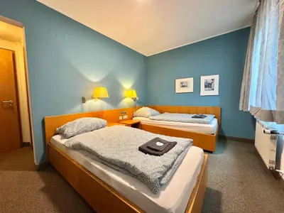 Ein Bett oder Betten in einem Zimmer der Unterkunft AR Airport Hotel Rüsselsheim