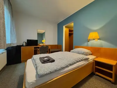 Ein Bett oder Betten in einem Zimmer der Unterkunft AR Airport Hotel Rüsselsheim