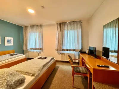 Ein Bett oder Betten in einem Zimmer der Unterkunft AR Airport Hotel Rüsselsheim