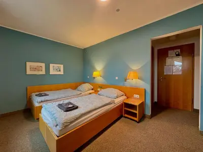 Ein Bett oder Betten in einem Zimmer der Unterkunft AR Airport Hotel Rüsselsheim