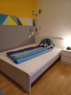 Ein Bett oder Betten in einem Zimmer der Unterkunft Appartement Farbenfroh