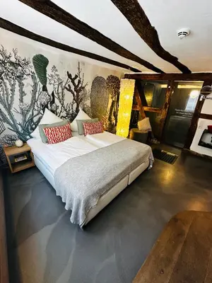 Ein Bett oder Betten in einem Zimmer der Unterkunft die Träumerei GmbH