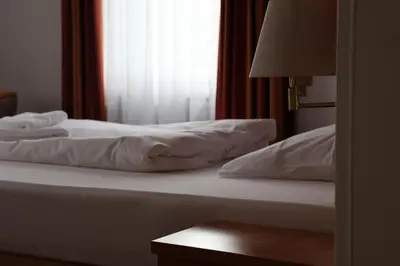 Ein Bett oder Betten in einem Zimmer der Unterkunft Hotel an der Therme