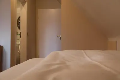 Ein Bett oder Betten in einem Zimmer der Unterkunft Hotel an der Therme