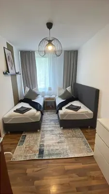 Ein Bett oder Betten in einem Zimmer der Unterkunft Charmantes Familienrefugium im Zentrum von Ludwigshafen - Eleganz & Komfort Ideal fur Familien