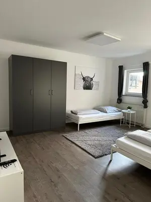 Ein Bett oder Betten in einem Zimmer der Unterkunft einladende Wohnung im Herzen von Sinsheim