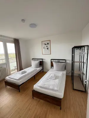 Ein Bett oder Betten in einem Zimmer der Unterkunft Monteurs Wohnung über den Dächern der Stadt
