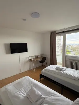 Ein Bett oder Betten in einem Zimmer der Unterkunft Monteurs Wohnung über den Dächern der Stadt