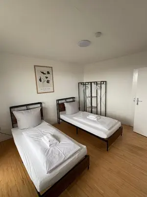 Ein Bett oder Betten in einem Zimmer der Unterkunft Monteurs Wohnung über den Dächern der Stadt