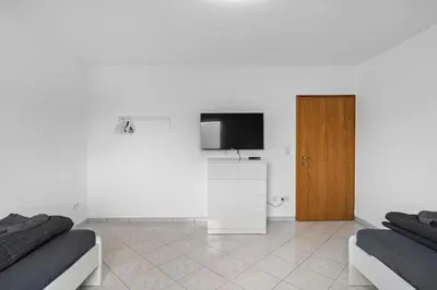 TV/Unterhaltungsangebot in der Unterkunft BA01 Moderne Wohnung in Flörsheim