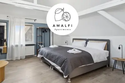 Ein Bett oder Betten in einem Zimmer der Unterkunft Amalfi A10 - 4 Betten - gemütlich und modern