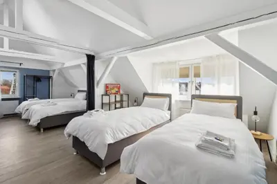 Ein Bett oder Betten in einem Zimmer der Unterkunft Amalfi A10 - 4 Betten - gemütlich und modern