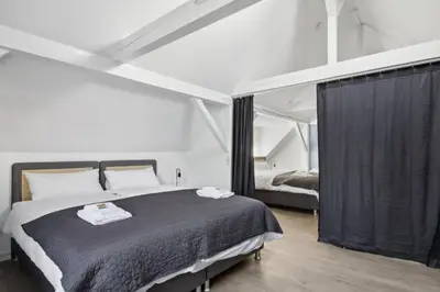 Ein Bett oder Betten in einem Zimmer der Unterkunft Amalfi A10 - 4 Betten - gemütlich und modern