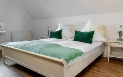 Ein Bett oder Betten in einem Zimmer der Unterkunft Landgasthaus Zum Engel