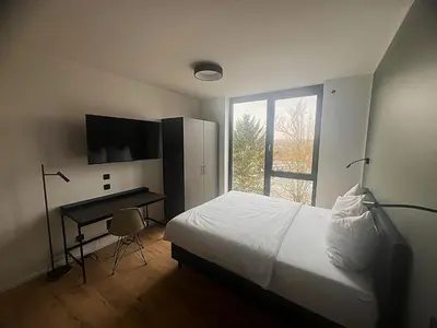 Ein Bett oder Betten in einem Zimmer der Unterkunft New Age Boardinghaus Bad Rappenau