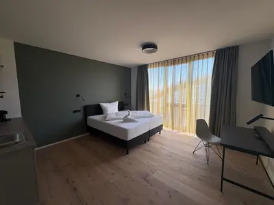 Ein Bett oder Betten in einem Zimmer der Unterkunft New Age Boardinghaus Bad Rappenau