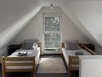 Ein Bett oder Betten in einem Zimmer der Unterkunft Moderne Maisonette-Wohnung