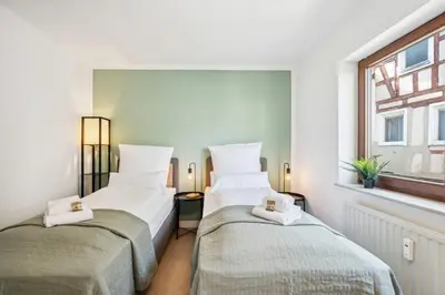Ein Bett oder Betten in einem Zimmer der Unterkunft Sali Homes Weingenuss Eichbrunnen - Zentral