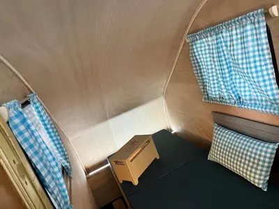 Ein Bett oder Betten in einem Zimmer der Unterkunft Tinydorf XXS