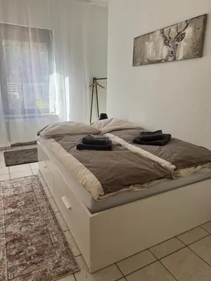 Ein Bett oder Betten in einem Zimmer der Unterkunft Helles APT Wiesbaden Mainz FFM 2 Schlafzimmer