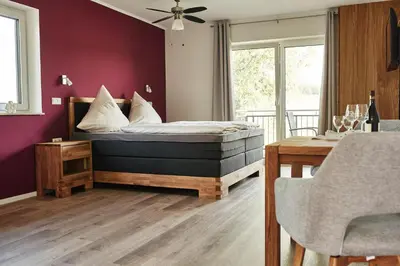Ein Bett oder Betten in einem Zimmer der Unterkunft Rotwein Apartment
