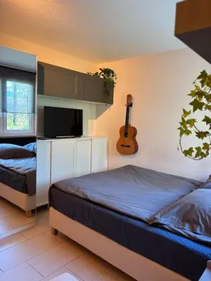 Ein Bett oder Betten in einem Zimmer der Unterkunft Cozy studio apartment