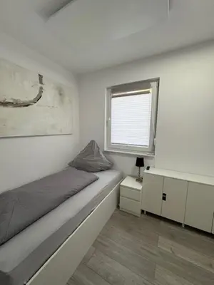 Ein Bett oder Betten in einem Zimmer der Unterkunft Hostel Kornwestheim