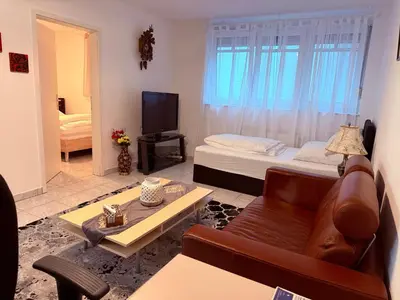 Ein Bett oder Betten in einem Zimmer der Unterkunft Holiday Apartment in Mörfelden-Walldorf