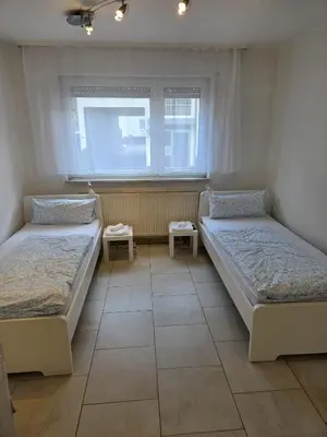 Ein Bett oder Betten in einem Zimmer der Unterkunft Apartment mit Wintergarten - Knielingen Industriepark