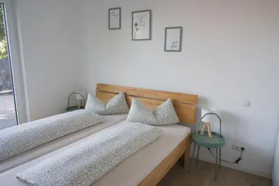 Ein Bett oder Betten in einem Zimmer der Unterkunft Ferienwohnung Im Wiesengrund