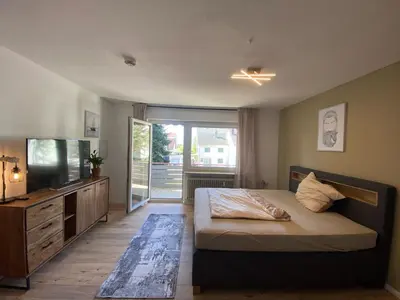 Ein Bett oder Betten in einem Zimmer der Unterkunft 1-Zimmerwohnung mit Balkon