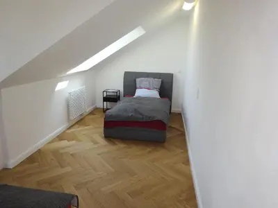 Ein Bett oder Betten in einem Zimmer der Unterkunft Ferienwohnung Rebenzauber Deidesheim