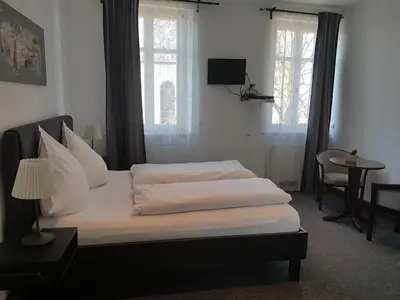 Ein Bett oder Betten in einem Zimmer der Unterkunft Gasthaus Zum Ochsen