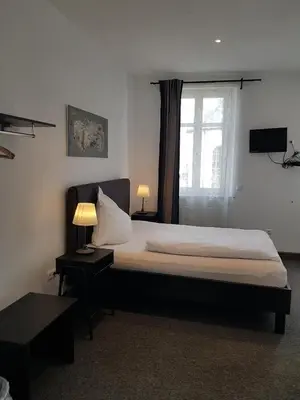 Ein Bett oder Betten in einem Zimmer der Unterkunft Gasthaus Zum Ochsen