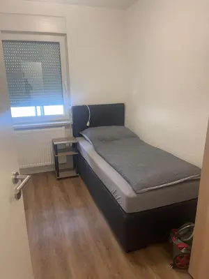 Ein Bett oder Betten in einem Zimmer der Unterkunft Modernes Wohnerlebnis in bester Lage