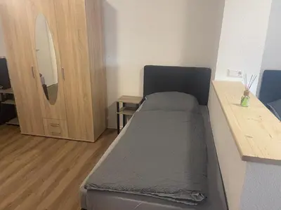 Ein Bett oder Betten in einem Zimmer der Unterkunft Modernes Wohnerlebnis in bester Lage