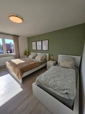 Ein Bett oder Betten in einem Zimmer der Unterkunft Moderne Wohnung mit Balkon in Karlsruhe