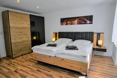Ein Bett oder Betten in einem Zimmer der Unterkunft FeWo Römerweg