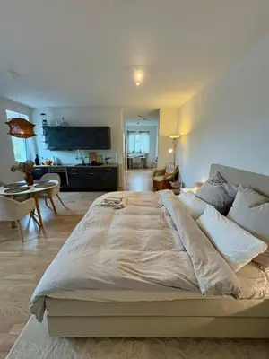 Ein Bett oder Betten in einem Zimmer der Unterkunft Tamm CityHub Zentral, Komfortabel, Tiefgarage