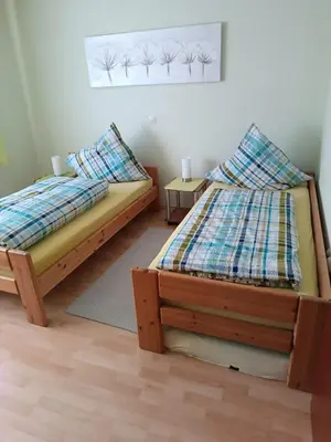 Ein Bett oder Betten in einem Zimmer der Unterkunft Ferienwohnung Schmid