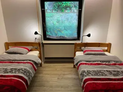 Ein Bett oder Betten in einem Zimmer der Unterkunft Ferienhaus zur Glockenhornquelle