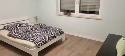 Ein Bett oder Betten in einem Zimmer der Unterkunft Wohnung K voll möbliert