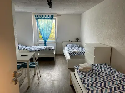 Ein Bett oder Betten in einem Zimmer der Unterkunft Boardinghouse Behrend I