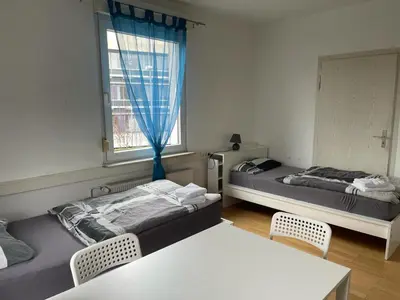 Ein Bett oder Betten in einem Zimmer der Unterkunft Boardinghouse Behrend I